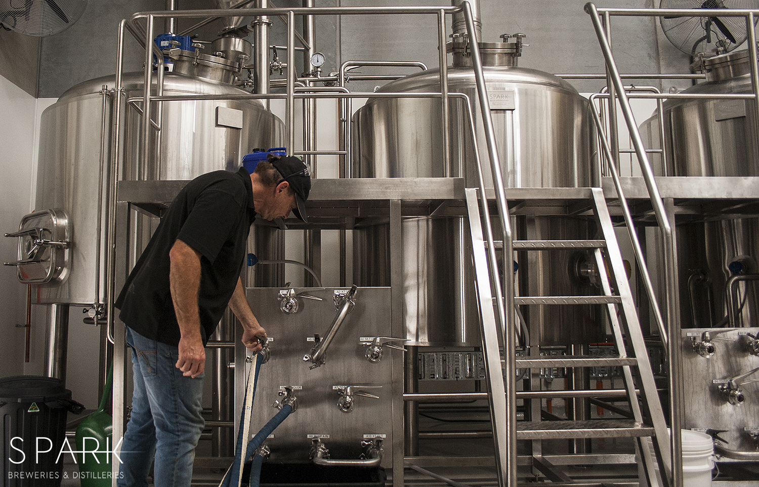 White Brick Brewing brewer operating brewhouse manifold