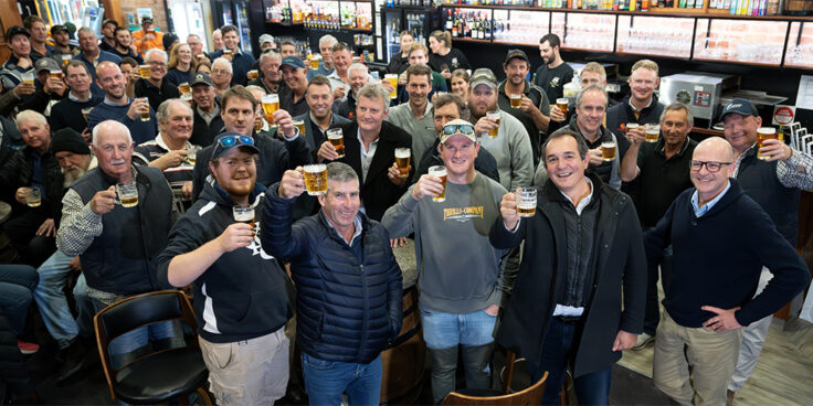 People holding beers up at the CUB barley celebration at Sea Lake Royal Hotel