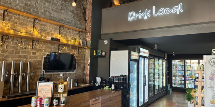 Interior of Local Drinks Collective's small bar and bottle shop that is for sale