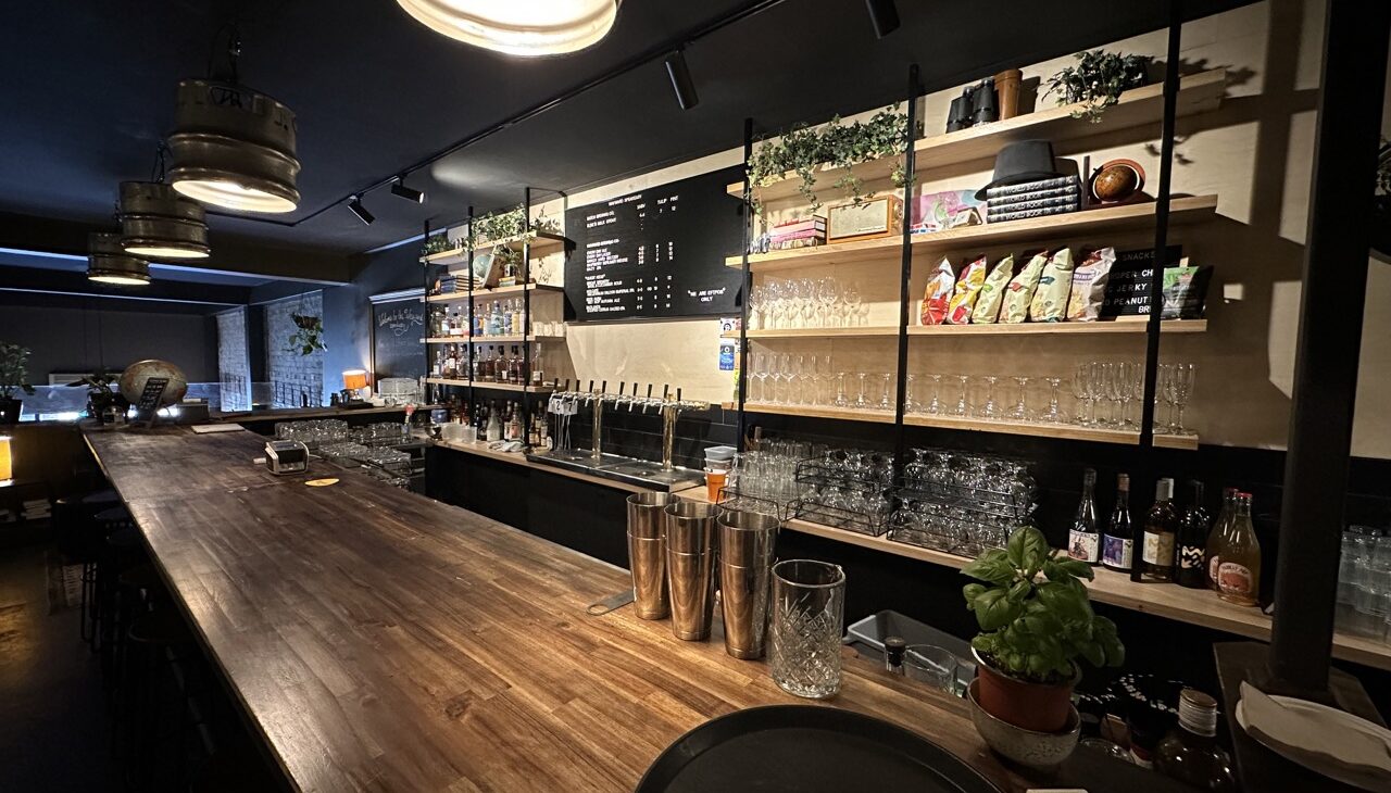 Interior of Local Drinks Collective's small bar and bottle shop that is for sale